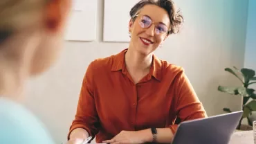 Employer happy at a interview whilst having a discussion with his candidate 