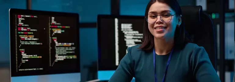 Women looking at computer screen smiling